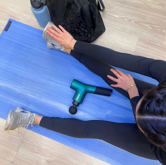 massage gun on the fitness mat