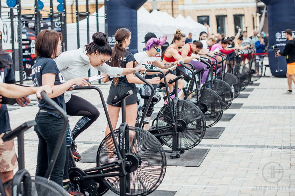 Athletes on Assault Bikes in the Gym