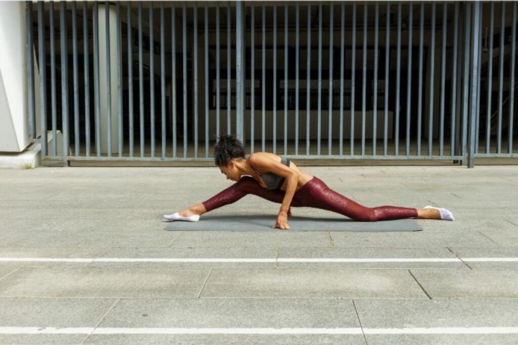 woman doing stretches for splits