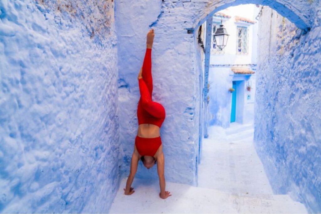 woman does wall handstand