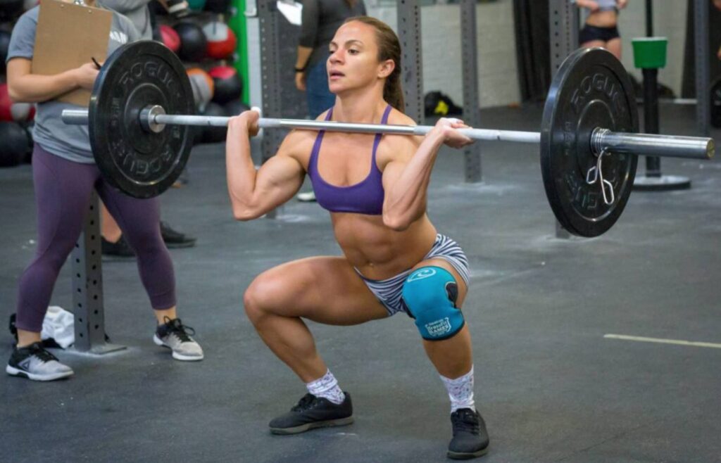 athlete woman hodling barbell on competition