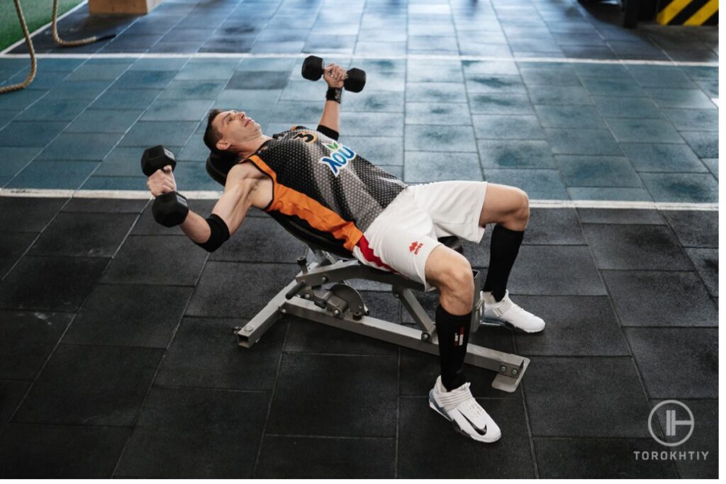 Dumbbells workout on weight bench