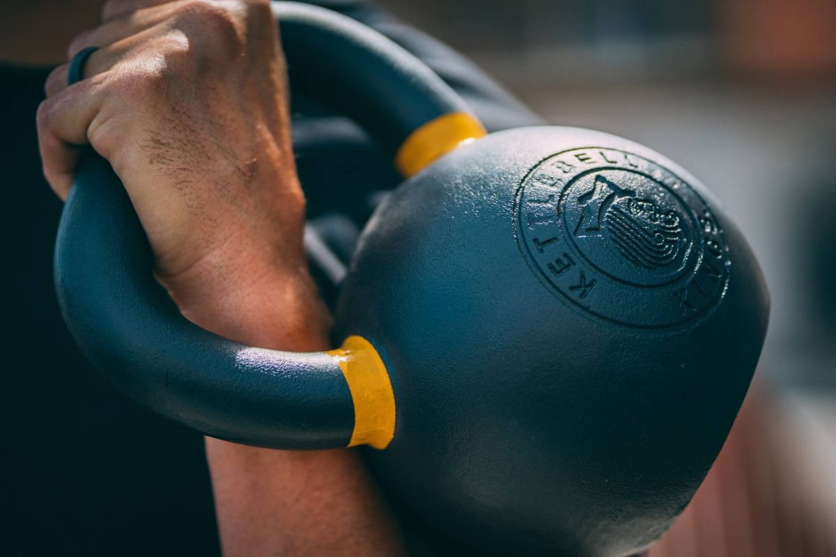 The athlet take a kettlebell