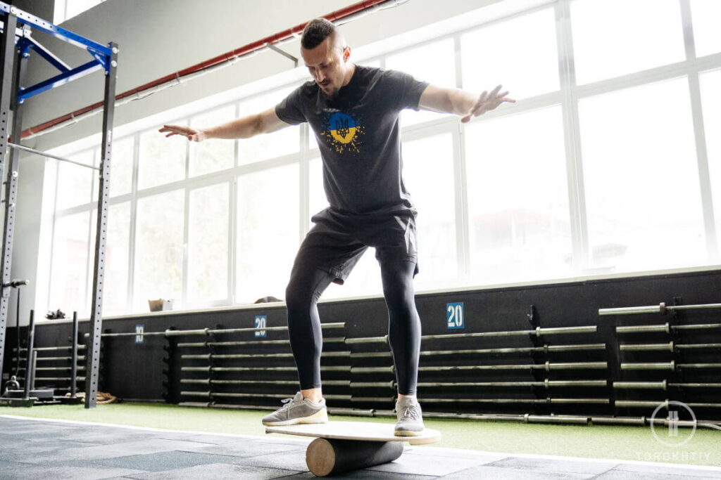 Athlete training on balance board