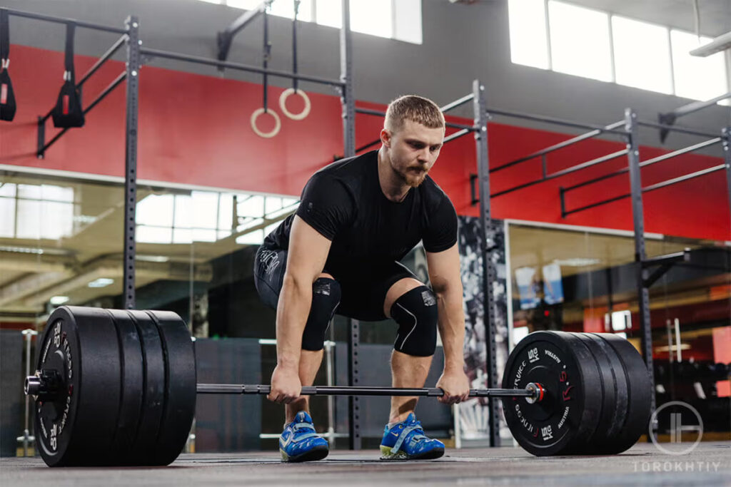 athlete deadlifting in the gym