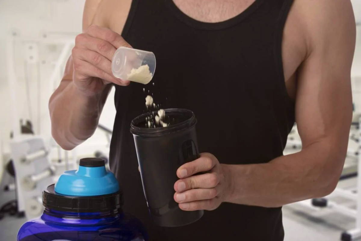 Athlete make his protein shake