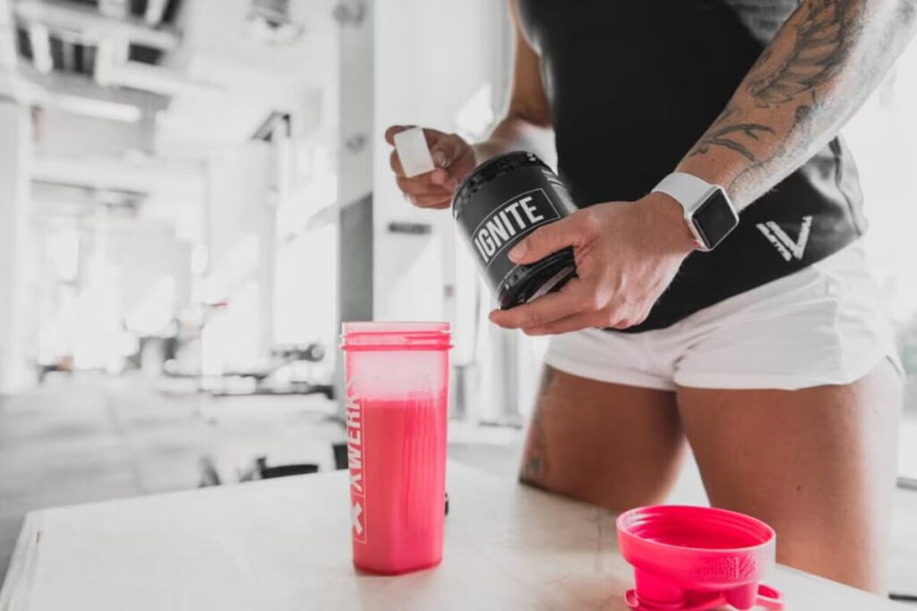 athlete making pre workout before training