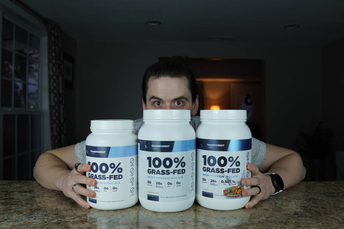 Athlete showing his pack of transparent labs protein