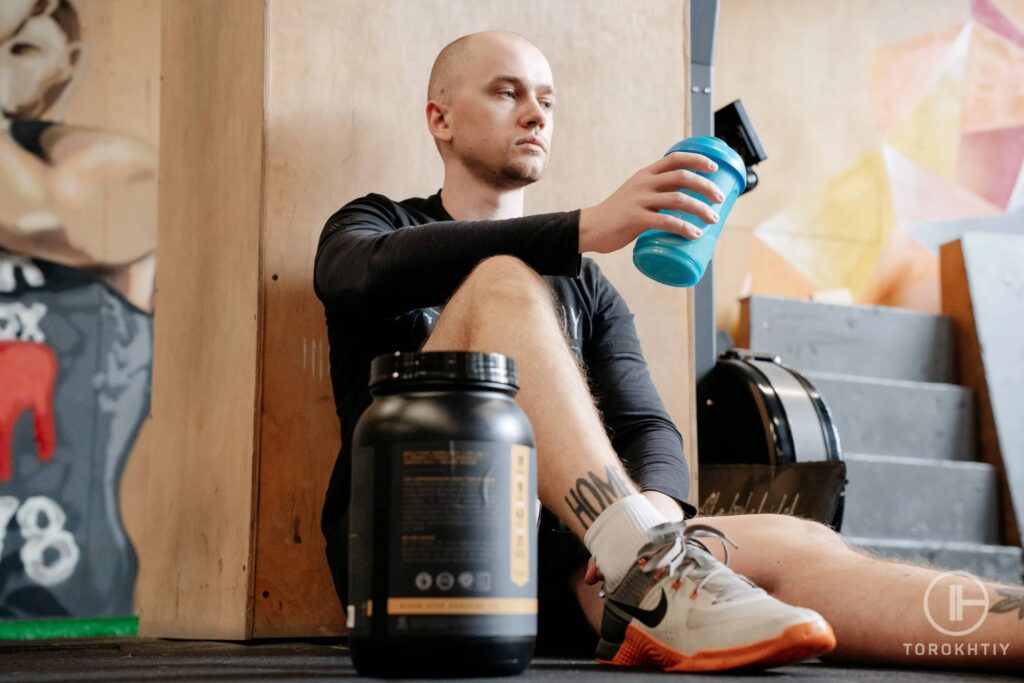 athlete drinks protein