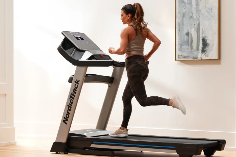 woman trains on treadmill