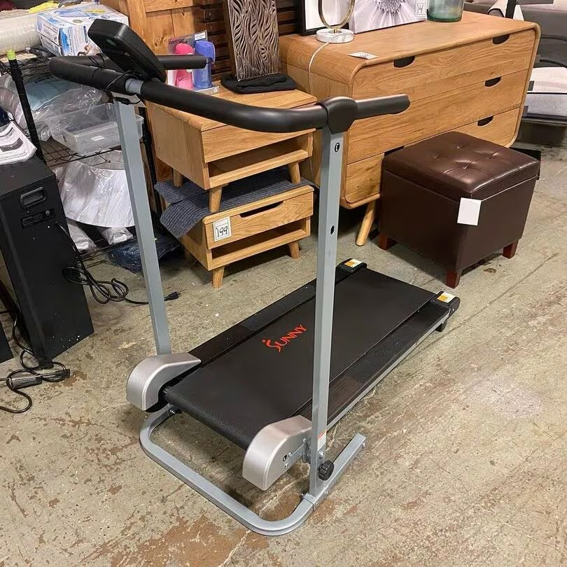 sunny fitness manual treadmill in garage