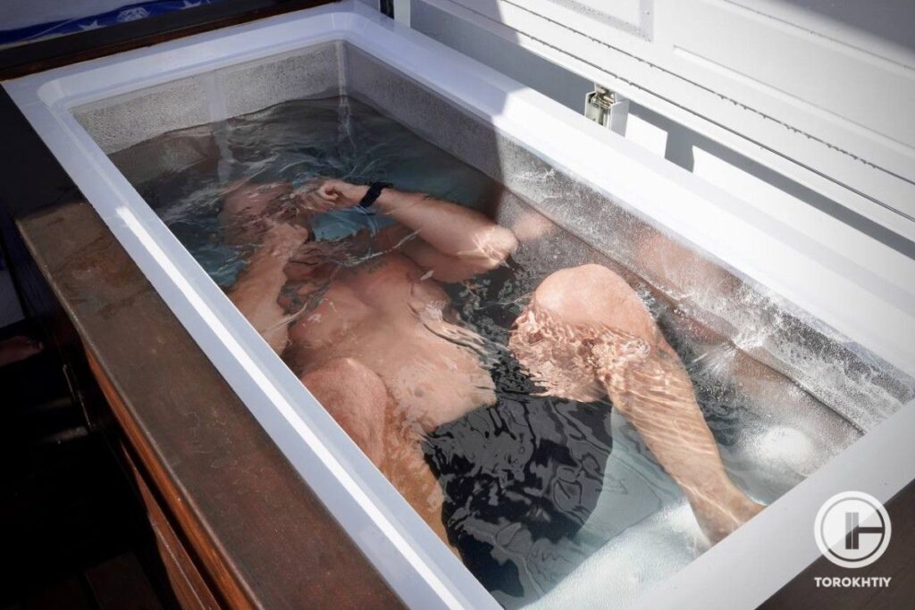 Athlete Diving in Ice bath