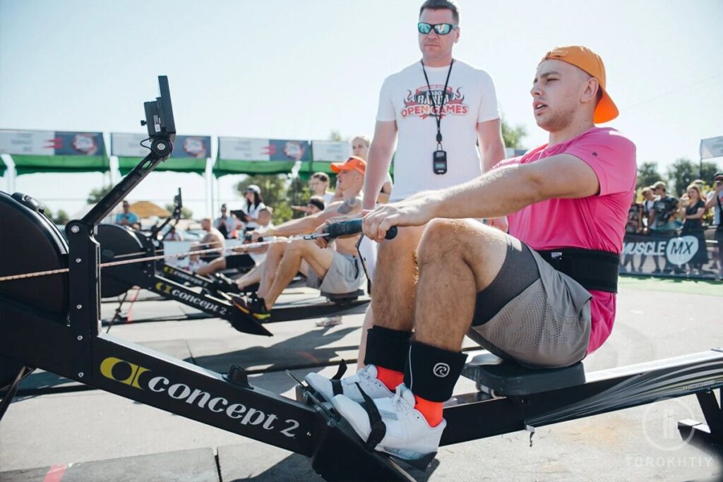 athlete in pink rowing