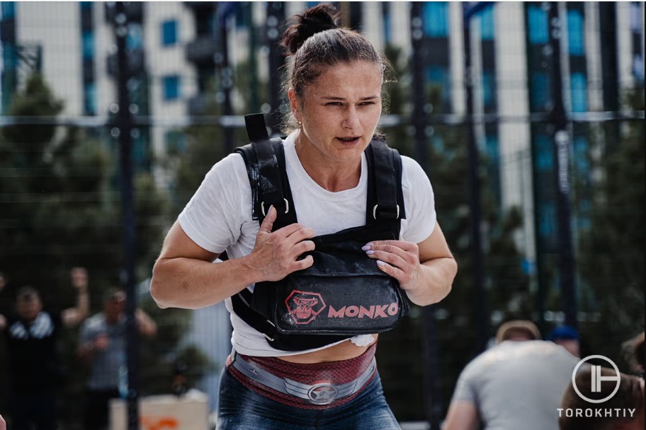 female athlete using weighted vest