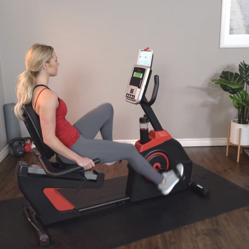 woman exercises on bike at home