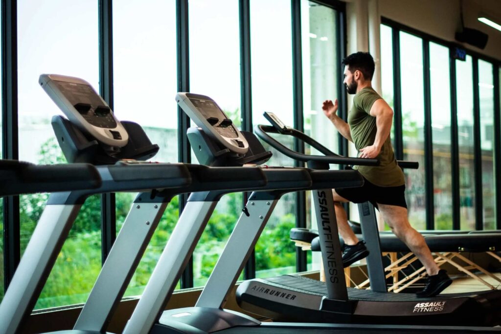 man exercise on treadmill in gym