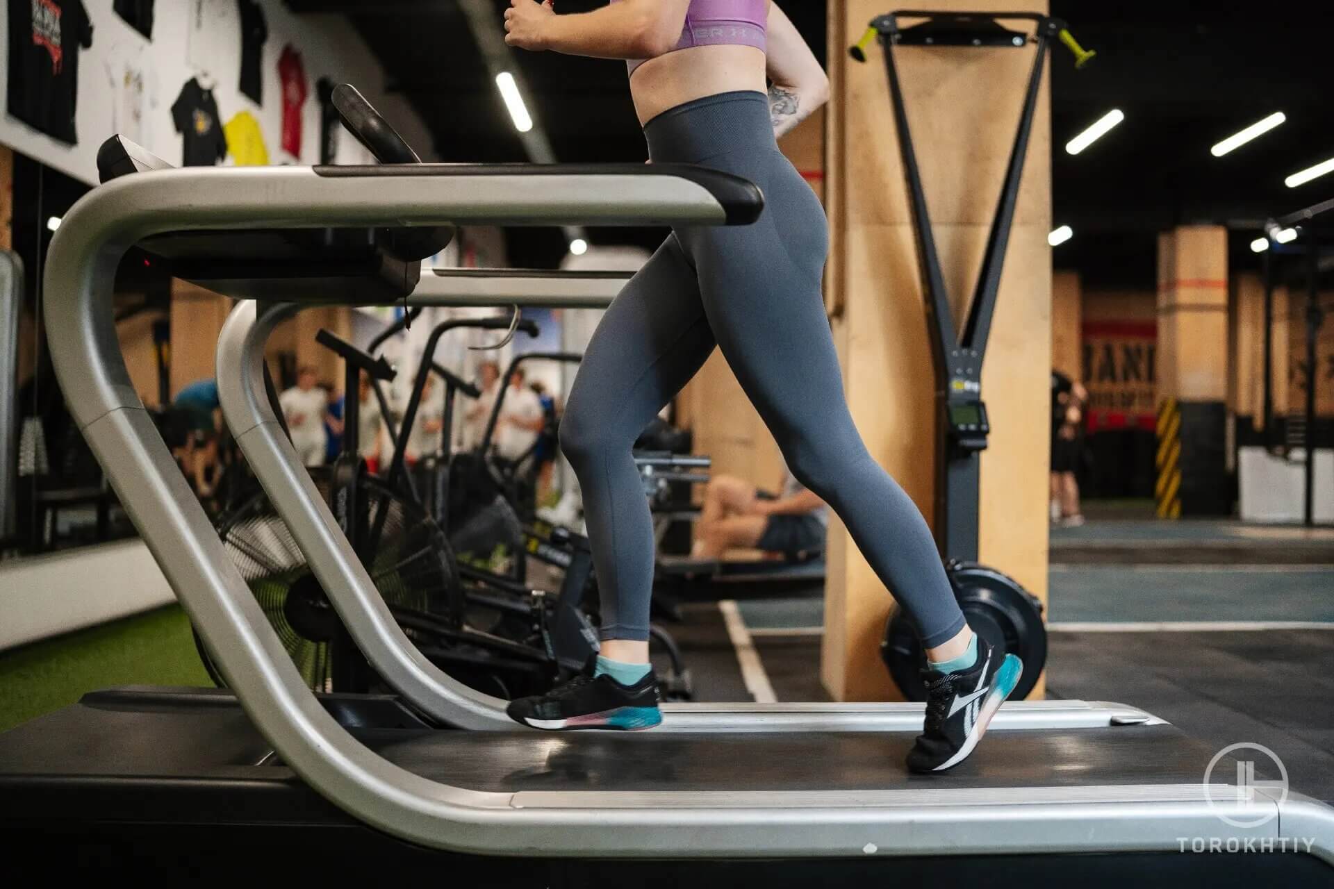 woman jogs on treadmill