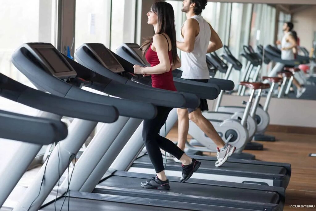 woman man exercise on treadmills in gym
