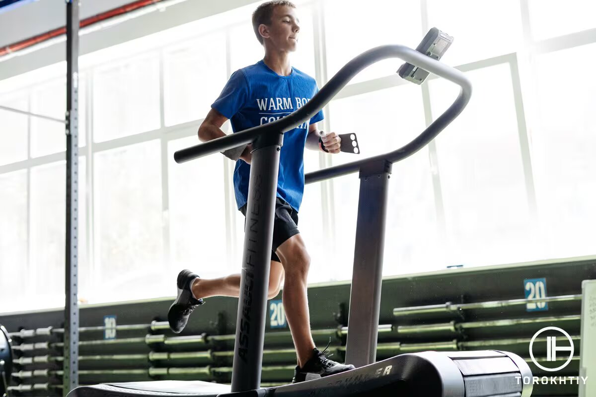 young athlete jogs on treadmill