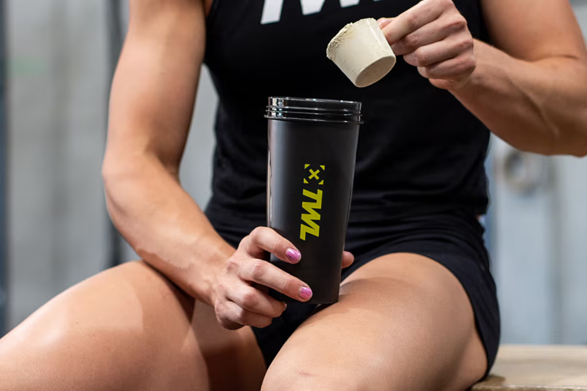 athlete makes protein milk shake