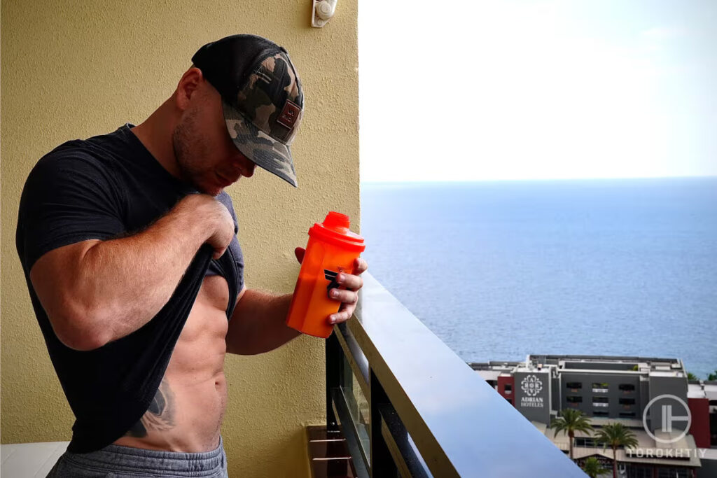 athlete drinks pre-workout drink