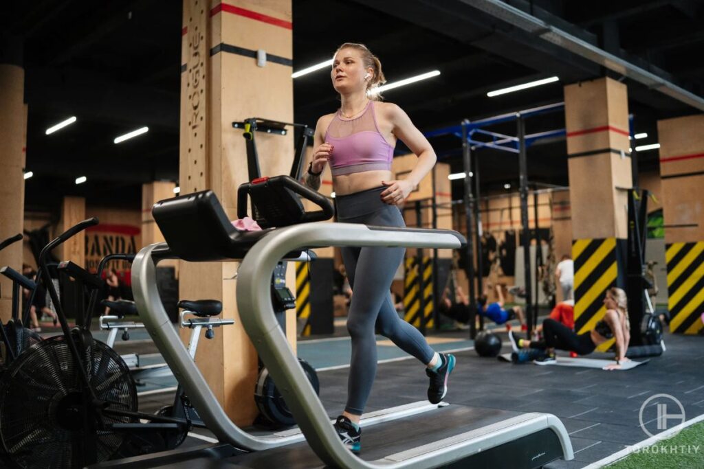 athlete woman running on treadmill