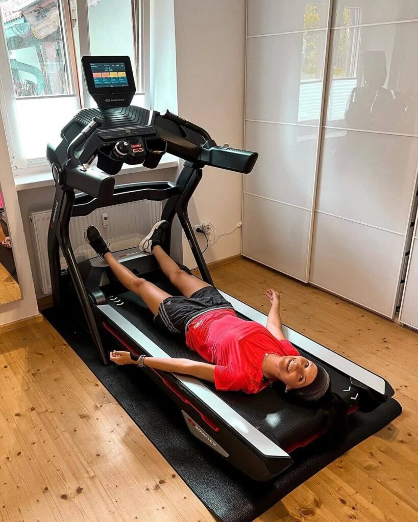 woman and treadmill at home gym