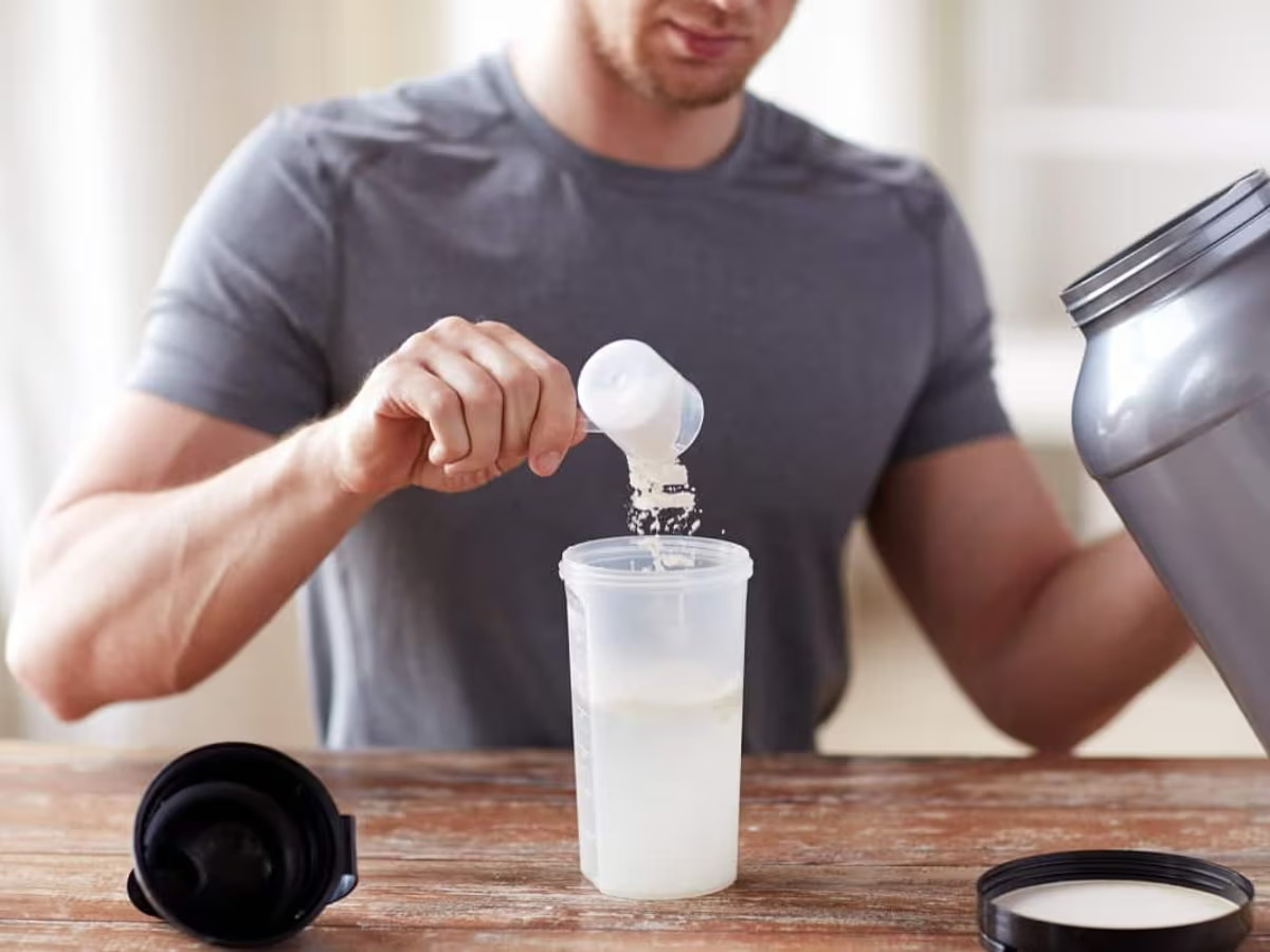 man making collagen protein shake