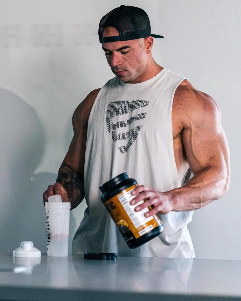 man making protein powder shake