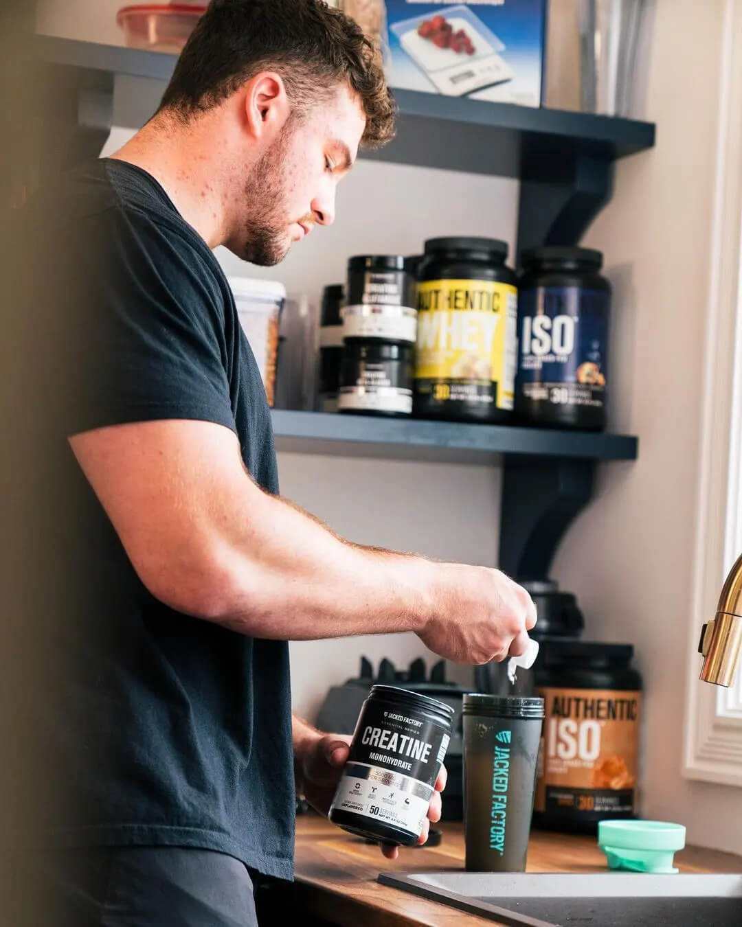 man taking scoop of jacked factory supplement