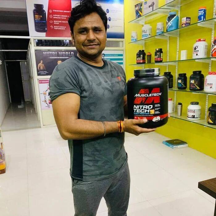 muscle tech post workout in hands