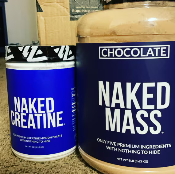 chocolate naked mass gainer bottles on table