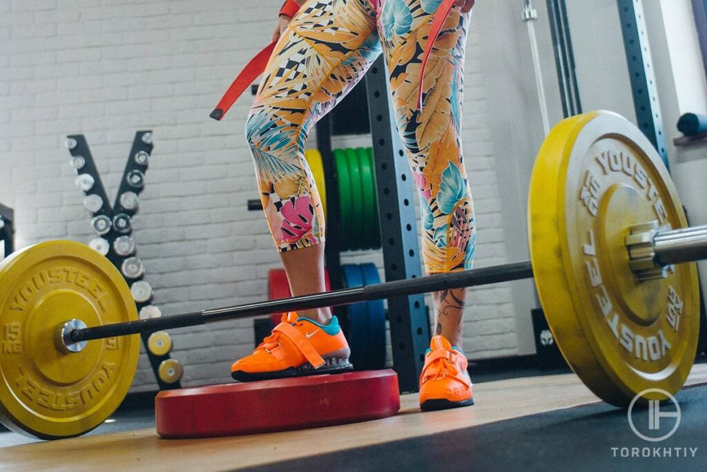 Woman in Nike shoes lifting
