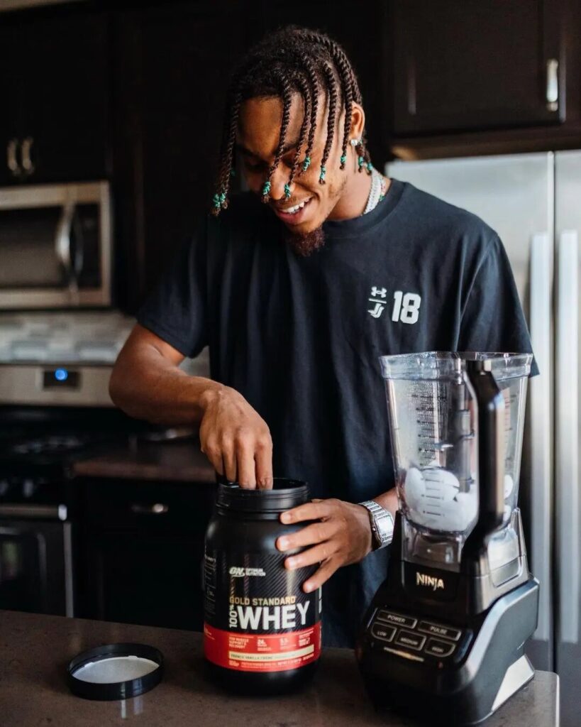 man making protein shake