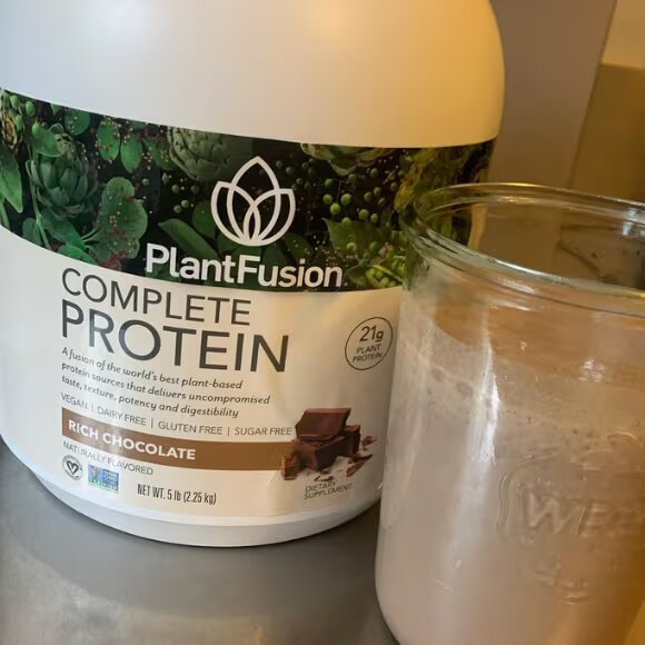 plant fusion bottle and protein shake in glass