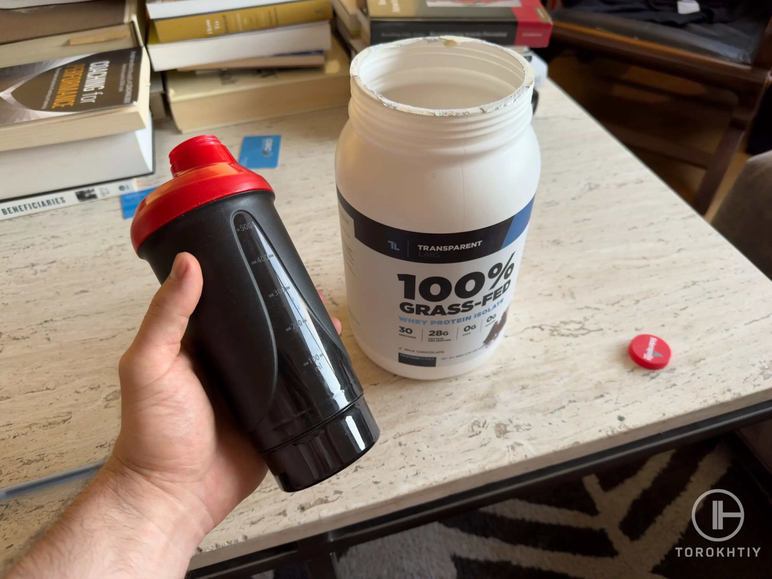 transparent labs grass fed protein bottle on table