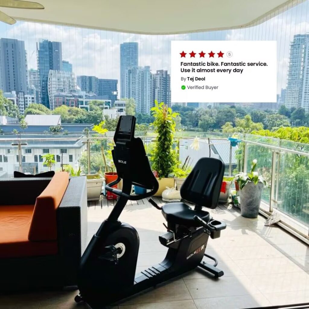 exercise bike in room with big windows