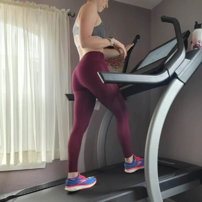 Woman on a NordicTrack commercial x22i incline treadmill