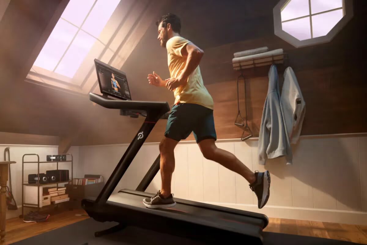 man workouts on treadmill at home gym