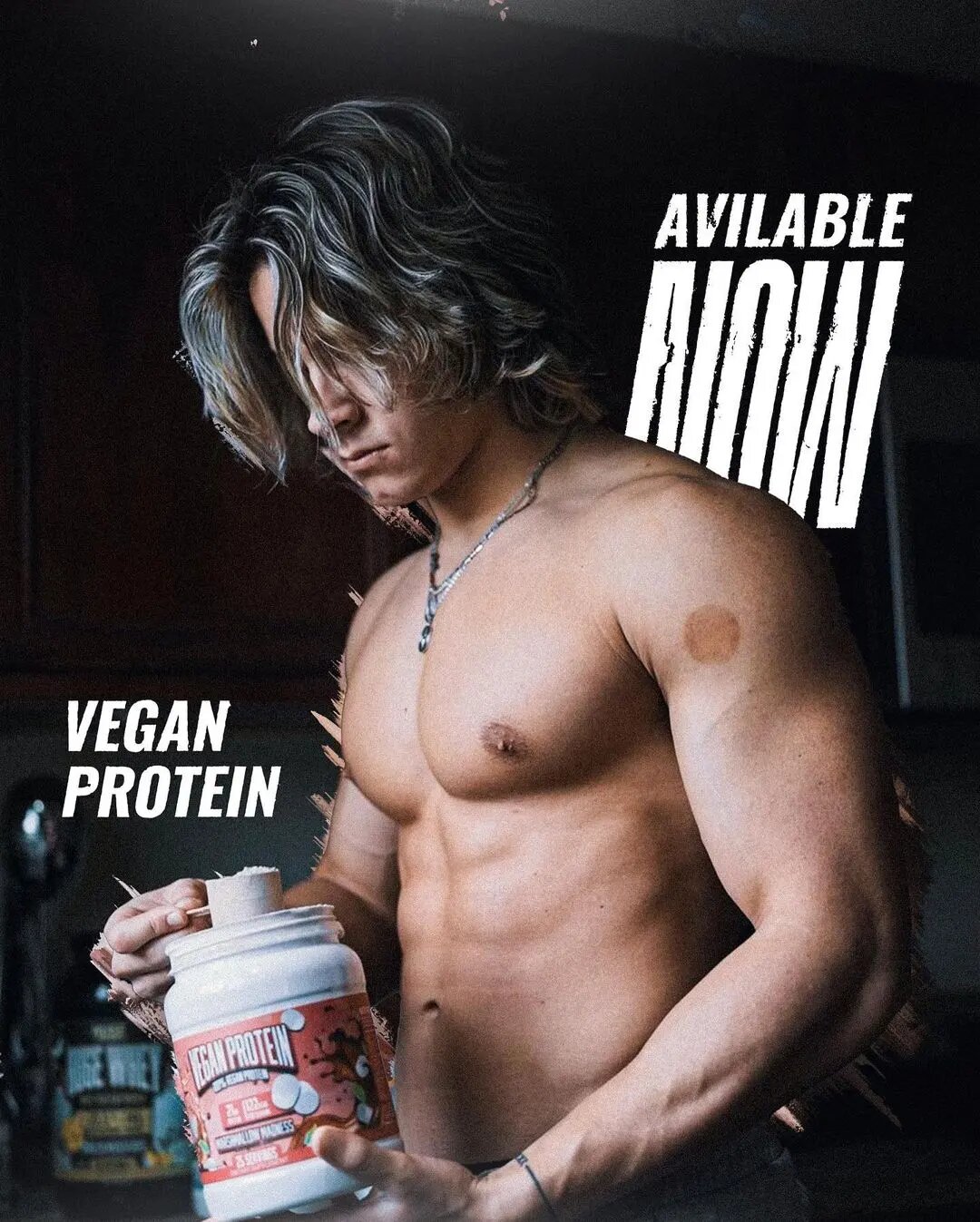 athlete holds vegan protein bottle