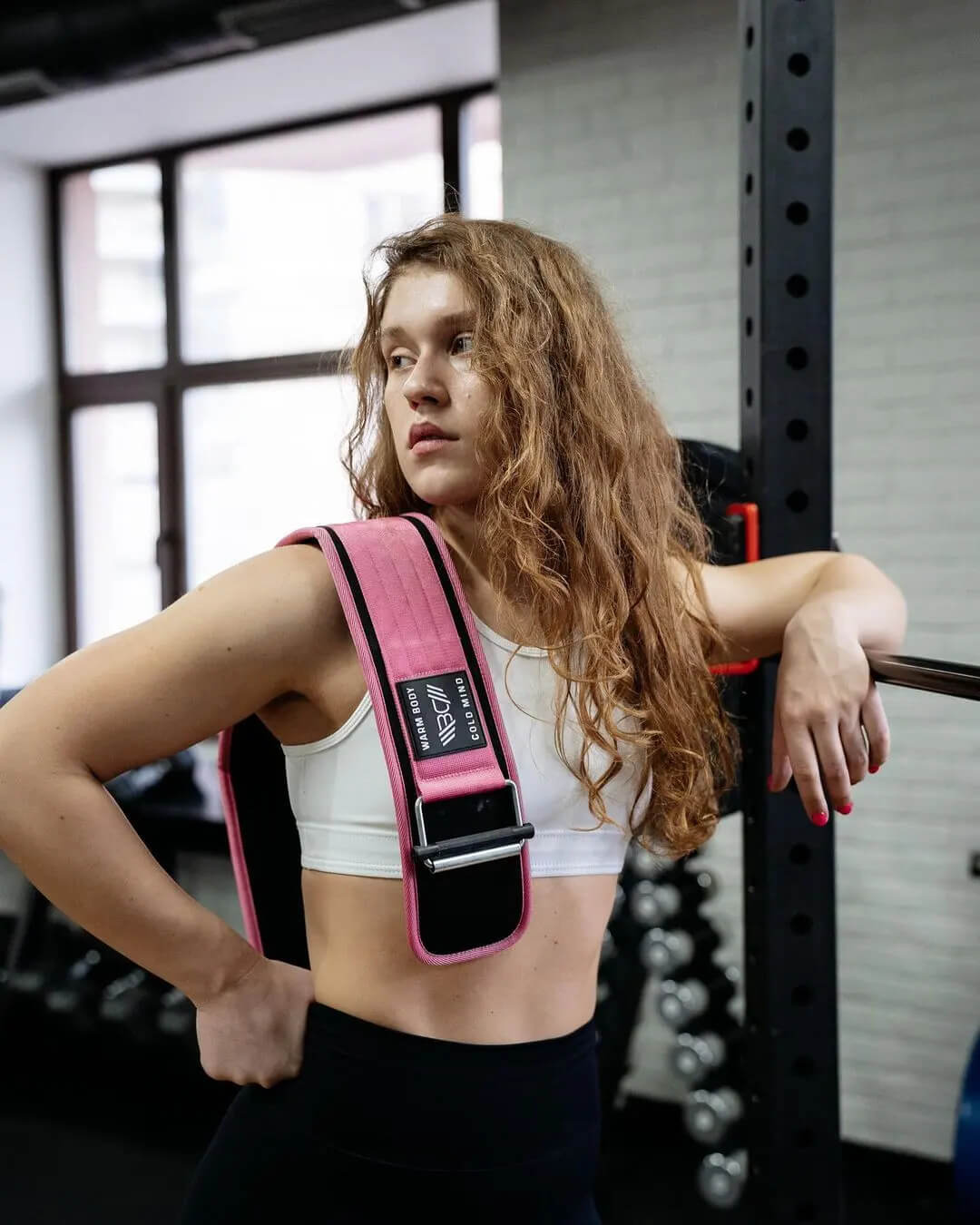 athlete woman holding nylon weight belt