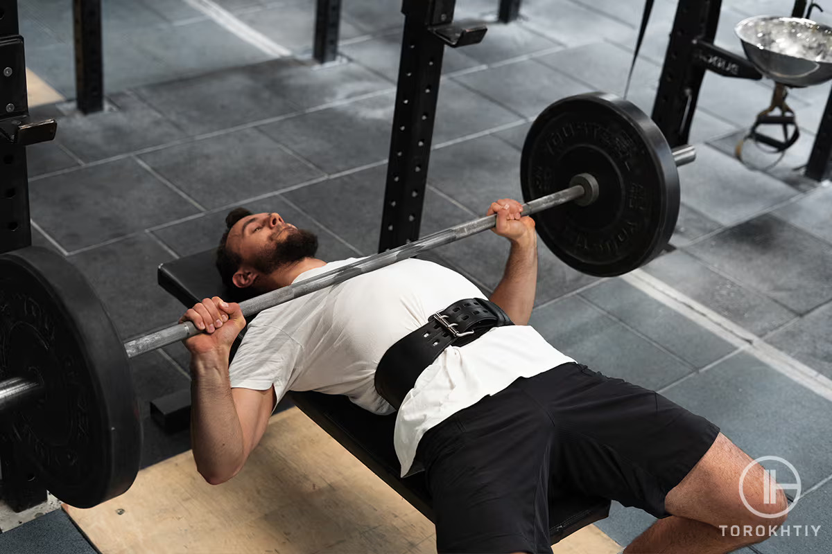 athlete working out with barbell