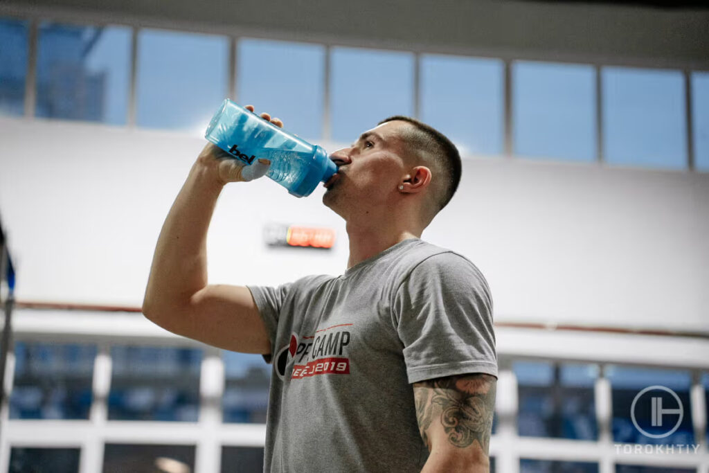 athlete drinks protein shake
