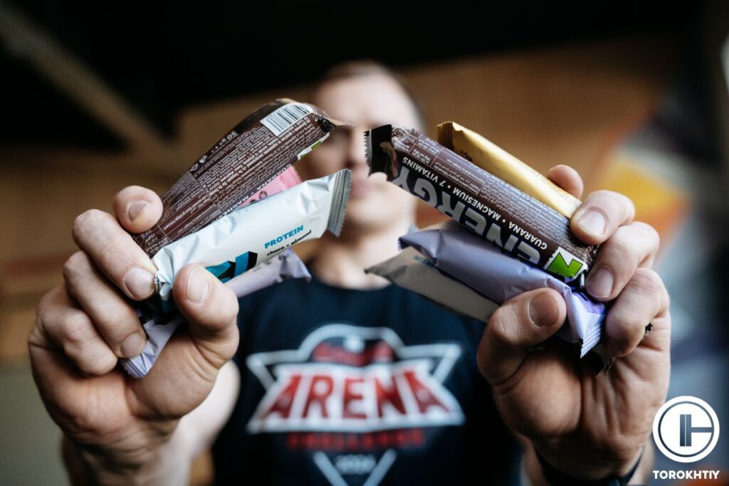 holding many protein bars
