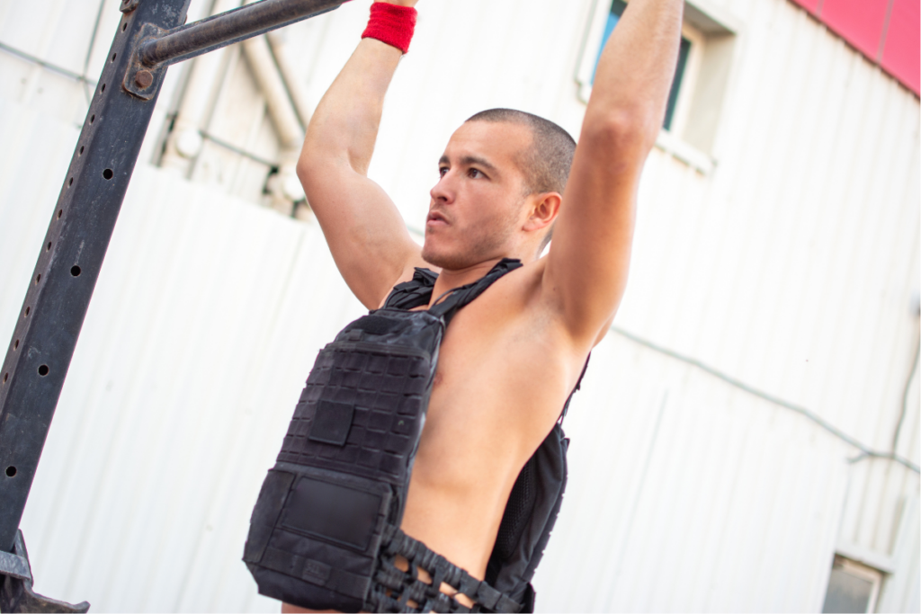 athlete training in the gym with weighted vest