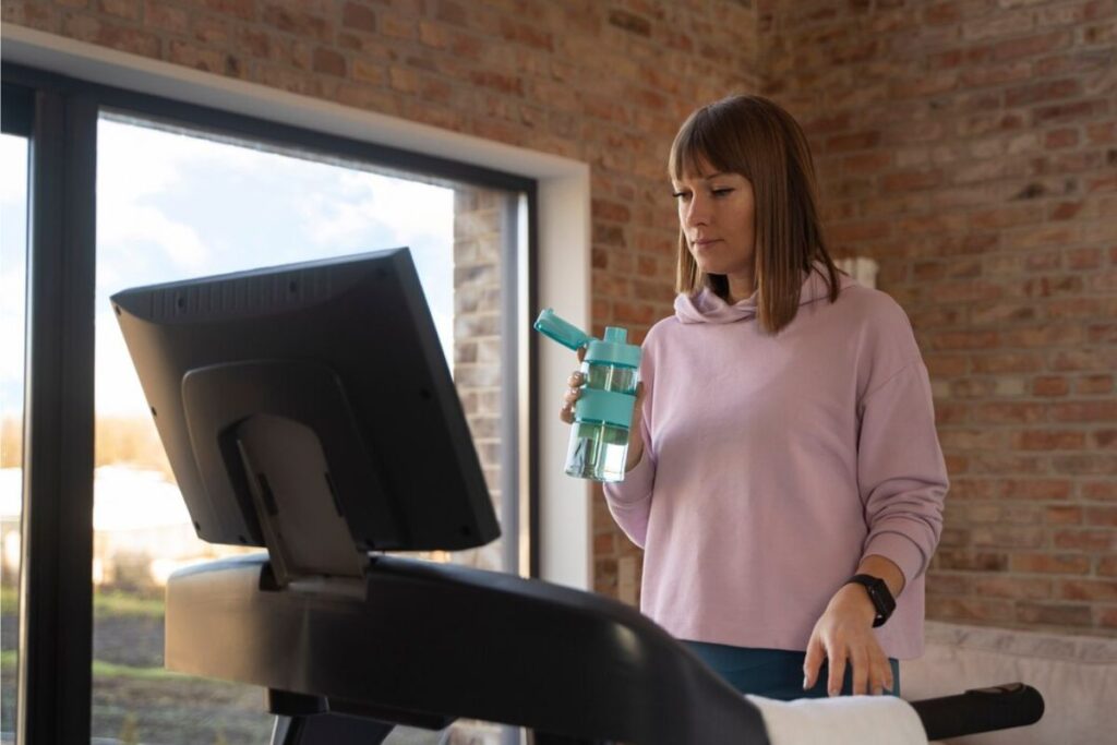 Walking on A Treadmill While Working by Freepik
