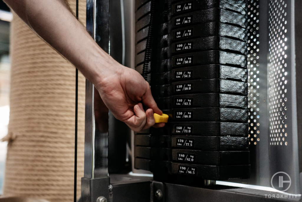 Man choose a weight to lift