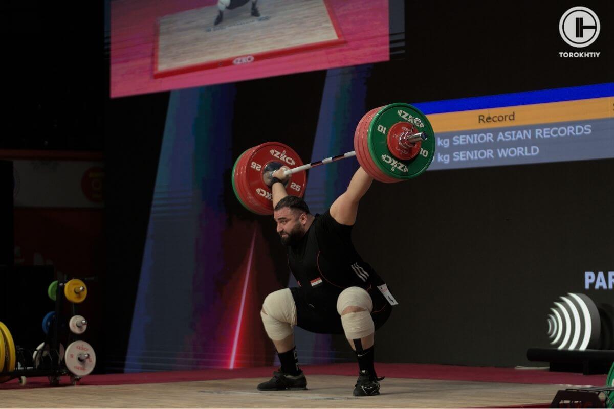 Man Asaad Lifting Barbell