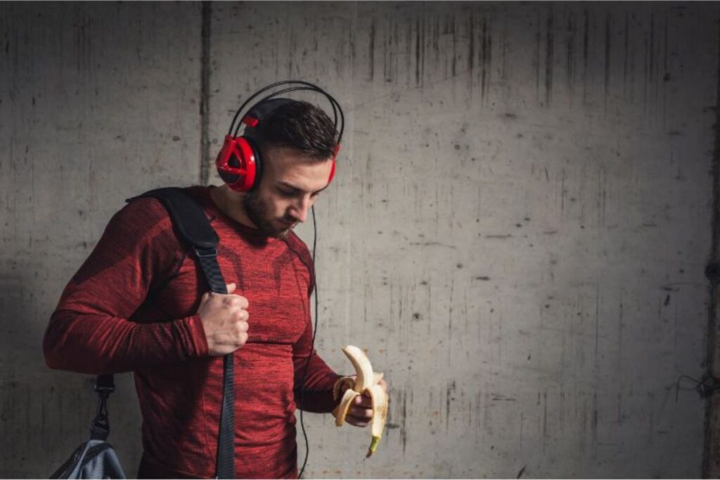 athlete eating banana