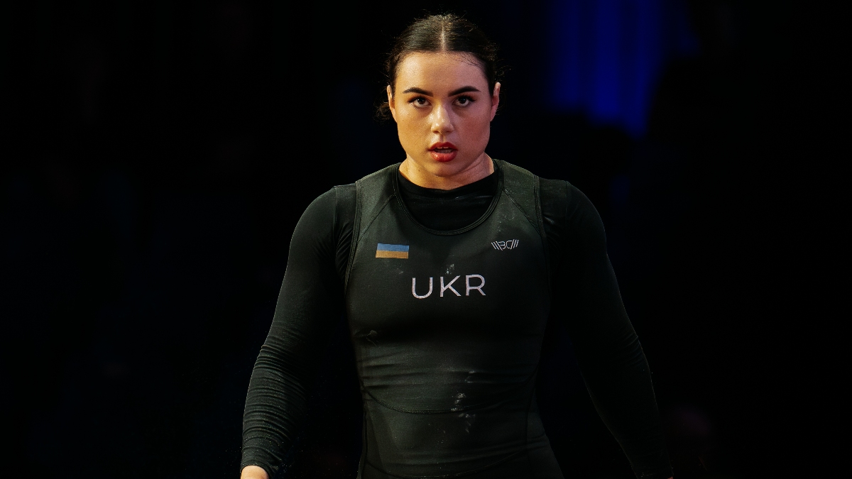 Dombrovska Iryna in competition attire, focused stance (Torokhtiy Weightlifting)